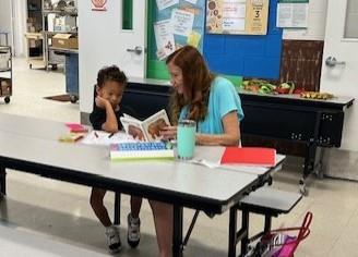 student with a reader